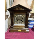 A mahogany mantle clock, the two train movement striking on a coiled gong. 14¼' high