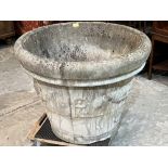 A garden urn with moulded decoration. 30' diam x 24' high