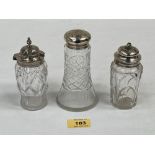 Two cut glass silver topped casters, the larger 5¼' high; together with a cut glass jar with