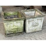 A pair of square garden urns with relief moulded decoration. 20'w x 19'h