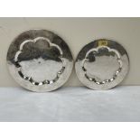 A graduated pair of silvered brass communion plates, possibly 18th century. 11½' diam and smaller