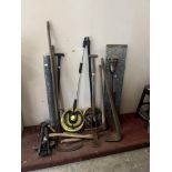 A quantity of long handled garden tools, other tools, wire netting etc.