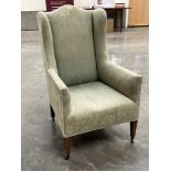 An Edward VII upholstered wing armchair