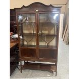 An Edward VII mahogany china display cabinet enclosed by a pair of astragal glazed doors. 40'w x