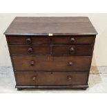 An antique oak chest of one long over two short drawers over two long drawers on block feet. 37'