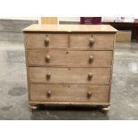 A Victorian pine chest of drawers on turned feet. 42' wide