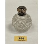 A silver topped cut glass scent bottle with stopper. c.1900. 3¼' high