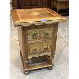 A teak inlaid table with two drawers. 20' wide