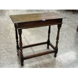 An antique joined oak side table on baluster turned legs with perimeter stretchers. 29' wide