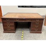 A late 19th century mahogany partner's desk, the leather inlet top over three drawers to each