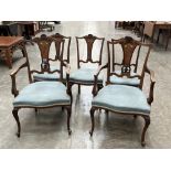 A set of five Victorian mahogany dining chairs with marquetry inlaid splats on cabriole forelegs