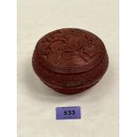A Chinese carved cinnabar jar and cover. 5' diam. Losses.