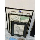 Three framed maps and a print