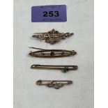 Three 9ct bar brooches. 4g gross and one plated