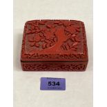 A Chinese carved cinnabar box. 4' wide