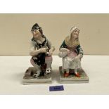 A pair of 19th century Staffordshire figures of a rustic with female companion. 6½' high. Glaze