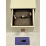 A gold and silver Clogau ring set with three white sapphires. 2.1g gross. Size L