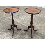 A pair of wine tables on tripod supports