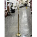 A brass three light lamp standard with frosted glass bell shades. 66' high