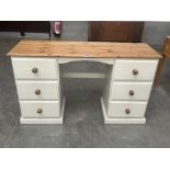 A painted pine kneehole dressing table. 54' wide