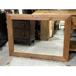 A pine framed wall mirror. 43' wide