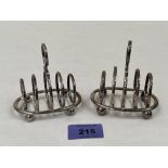 A pair of Edward VII silver toastracks by Walker and Hall. Sheffield 1909. 3¼' long. 4ozs 7dwts