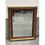 A gilt framed wall mirror. 36' high