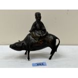 A Japanese bronze censer, modelled as a Tao Philosopher Lazo riding a water buffalo. 5¼' high.