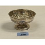 An Edward VII silver bowl on stepped foot, repousse decorated with scrolled foliage. Birmingham