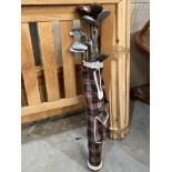 A vintage golf bag with clubs