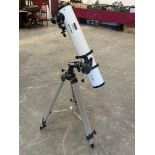 A Meade astronomical telescope on tripod stand. Tube 34' long