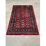 A red ground eastern rug. 76' x 50'