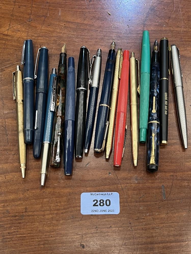 A collection of pens, three with 14ct nibs