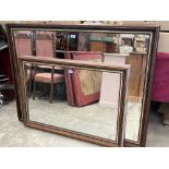 Two wall mirrors with bevelled plates, the larger 51' wide