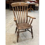 A Victorian beechwood lath-back armchair with elm seat