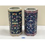 Two Chinese famille-rose hexagonal vases decorated with trailing foliage on a blue ground. 11'; 10¾'