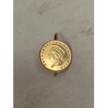 Gold Coin. An 1862 gold 1 Dollar Liberty coin, mounted as a brooch. 14.5mm diam.