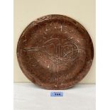 A late 19th century Persian copper dish, overlaid in silver with calligraphy and stylised foliage on