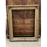 A Victorian gilt gesso picture frame. Aperture size 39' x 31'