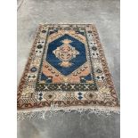 An eastern carpet. 84' x 55'. Faded