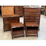 A suite of stag bedroom furniture to comprise two chests of drawers and a pair of bedside tables. (