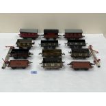 A collection of Hornby and other 'O' gauge tinplate rolling stock with two signals