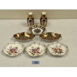 Royal Crown Derby. A Japan pattern pepperette and salt shaker; three Derby Posies dishes; a pair