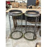 A pair of metal park bins. 35' high