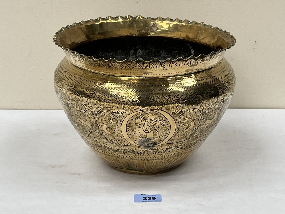 A 19th century brass jardiniere, with engraved decoration of trailing foliage. 11' diam.