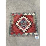 A Chobi Kilim rug. 0.44m x 0.48m