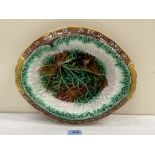 A majolica bread dish, leaf moulded with verse to rim. 13' wide