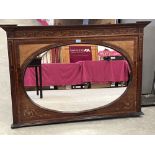 An Edward VII mahogany line and foliate inlaid overmantle with oval plate. 48' wide