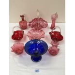 Eight items of cranberry glass and a blue glass comport