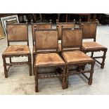 A set of six 1930s 17th century style oak dining chairs with leather backs and seats